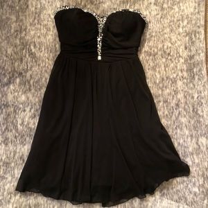 Black with beaded top open back homecoming dress.